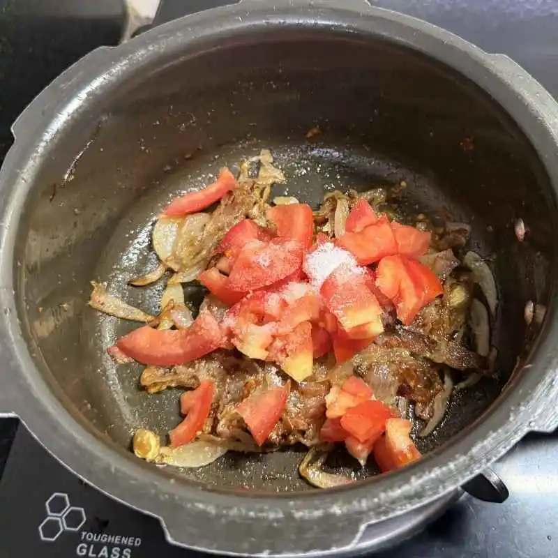 Add the Tomato and Salt, Cook Until Soft and Mushy